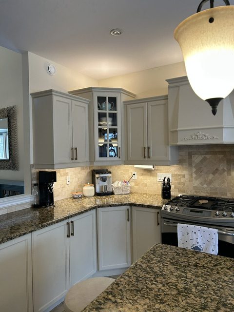 Custom coffee station featuring professionally refinished kitchen cabinets in an Ancaster home.